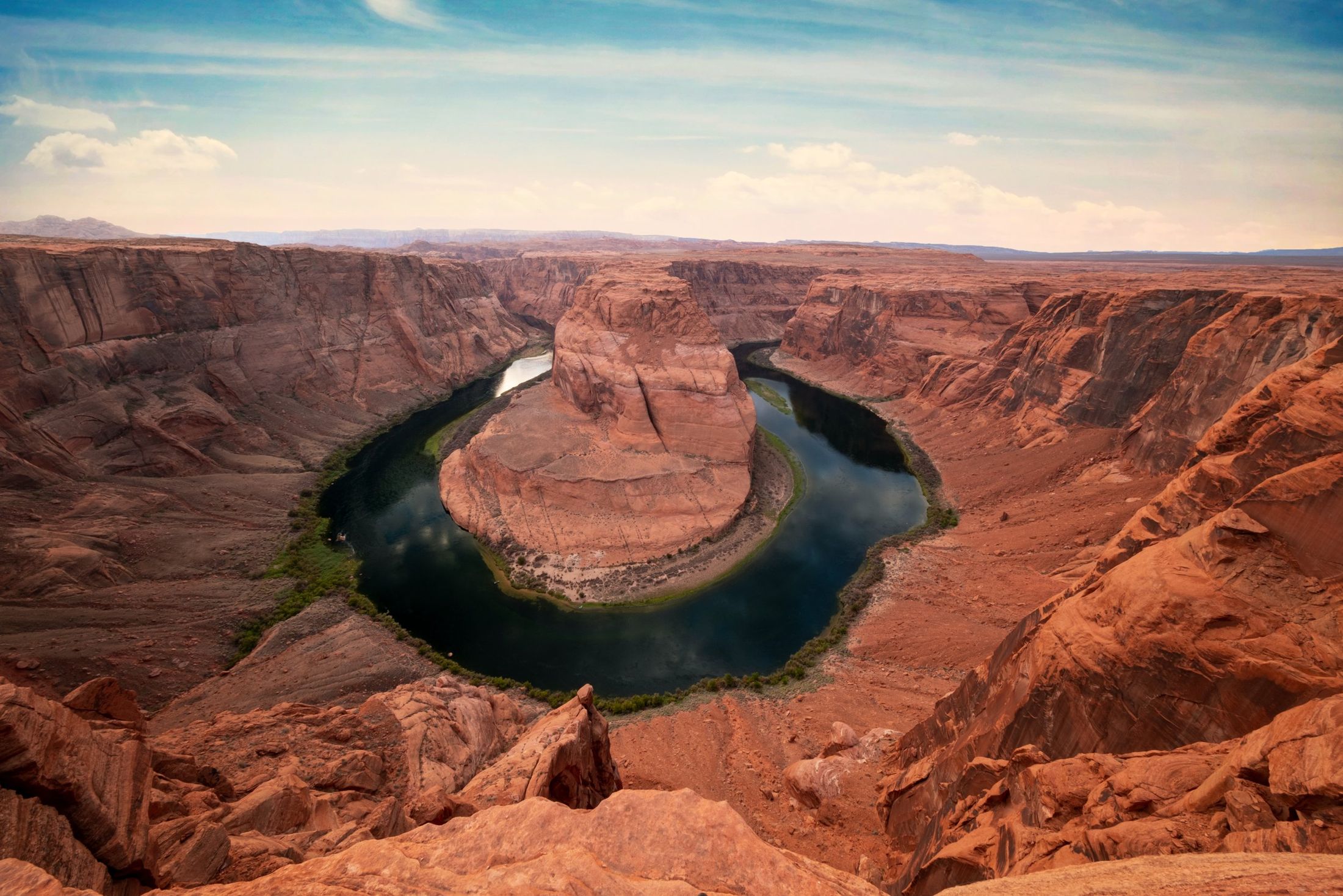Horseshoe Bend at sunset, Colorado River curving through red rock